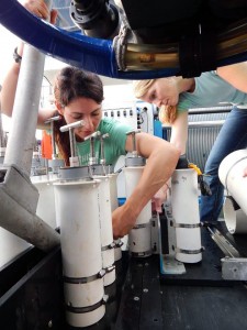 Leila Hamdan, of George Mason University, and Melanie Damour, of the Bureau of Ocean Energy Management, prepare the ROV before a dive during the Gulf of Mexico Shipwreck Study expedition in July 2014. Hamdan and Damour lead a multi-disciplinary team of scientists examining the effects of Deepwater Horizon spill-related oil and dispersant exposure on deep-water shipwrecks and their microbial communities. Credit: BOEM/Dan Warren, C&C Technologies. 