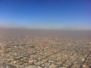 In the lower atmosphere, sunlight reacts with nitrogen oxides, methane and other volatile organic molecules to produce ozone. At this level of the atmosphere, ozone acts as a pollutant, rather than a protectant, as shown in this aerial photo of Mexico City. New research shows that if emission rates continue unchecked, some regions of the United States could experience between three and nine additional days per year of unhealthy ozone levels by 2050. Credit: Fidel Gonzalez via Wikimedia Commons. 