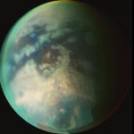 New research provides evidence of rainfall on the north pole of Titan, the largest of Saturn’s moons, shown here. The rainfall would be the first indication of the start of a summer season in the moon’s northern hemisphere, according to the researchers. Credit: NASA/JPL/University of Arizona