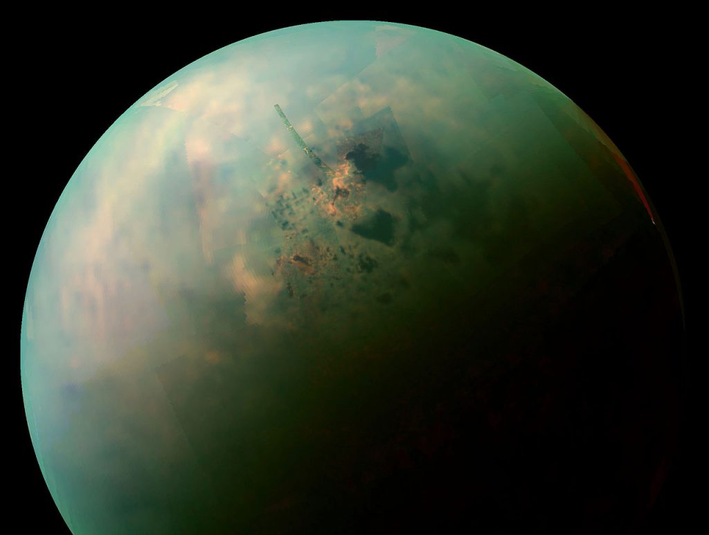 False-color near infrared view of Titan's northern hemisphere collected by NASA's Cassini spacecraft showing the moon's seas and lakes. Orange areas near some of them may be deposits of organic evaporite minerals left behind by receding liquid hydrocarbon.  Image credit: NASA / JPL-Caltech / Space Science Institute 