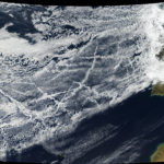 Pollution from ships creates lines of clouds that can stretch hundreds of miles in this satellite image taken 16 January 2018, off the coast of Europe. The narrower ends of the clouds are youngest, while the broader, wavier ends are older. Credit: NASA Earth Observatory