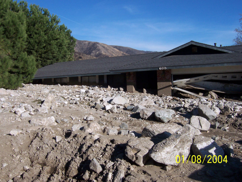Damage from a major post-wildfire landslide that occurred on 25 December 2003 near Devore, San Bernardino County as a result of the Old/Grand Prix fires that ran through the San Bernardino Mountains. Credit: USGS/Sue Canton. 