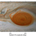 A photograph from the Juno spacecraft shows a piece of Jupiter's Great Red Spot peeling away as it encounters another storm.