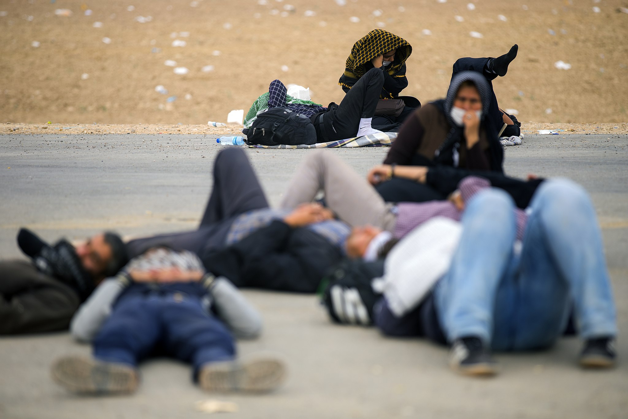 Arba’een foot pilgrims resting on a hot day. 