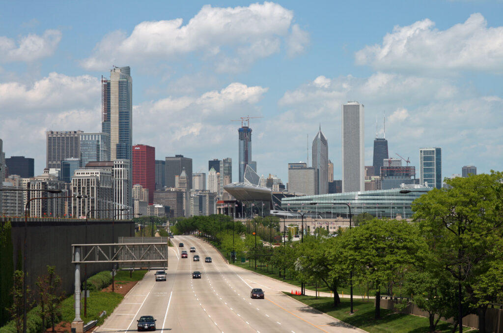 A highway in Chicago, Illinois, bordered by trees.