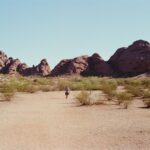 A lone hiker in a desert landscape near Tempe, Arizona, USA.
